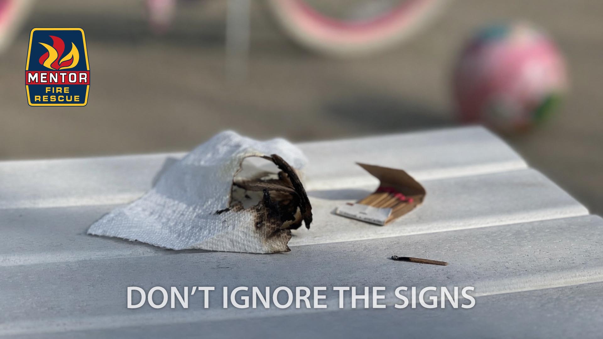 An image of a partially burned piece of paper and matches overlayed with the Mentor Fire Rescue logo and the words "Don't Ignore the Signs".