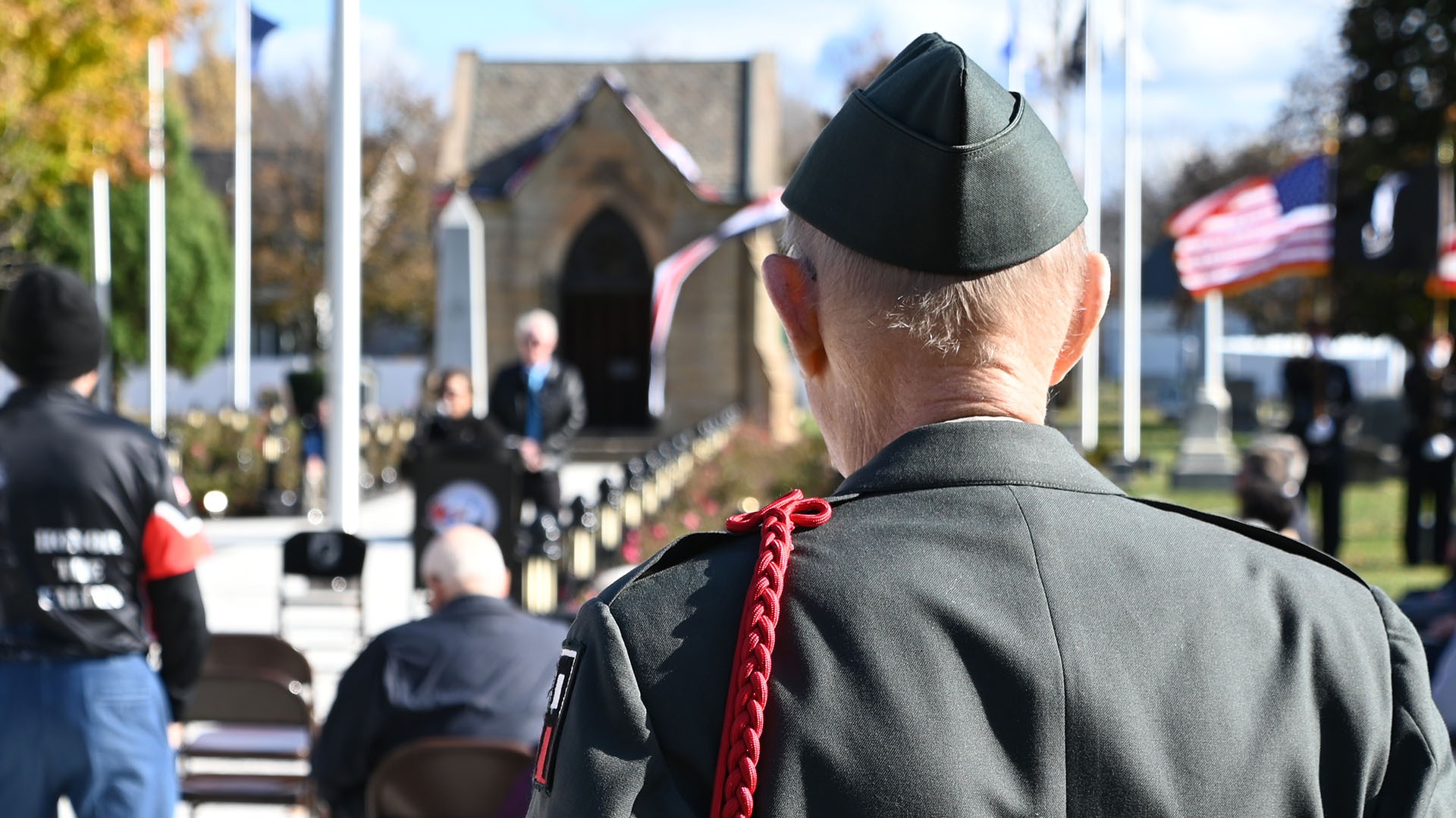 Veteran standing at attention during ceremony