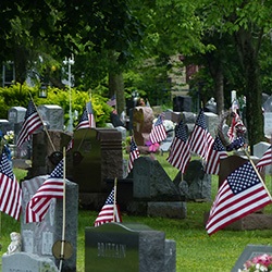 Veteran flags marking headstones at Mentor cenetery