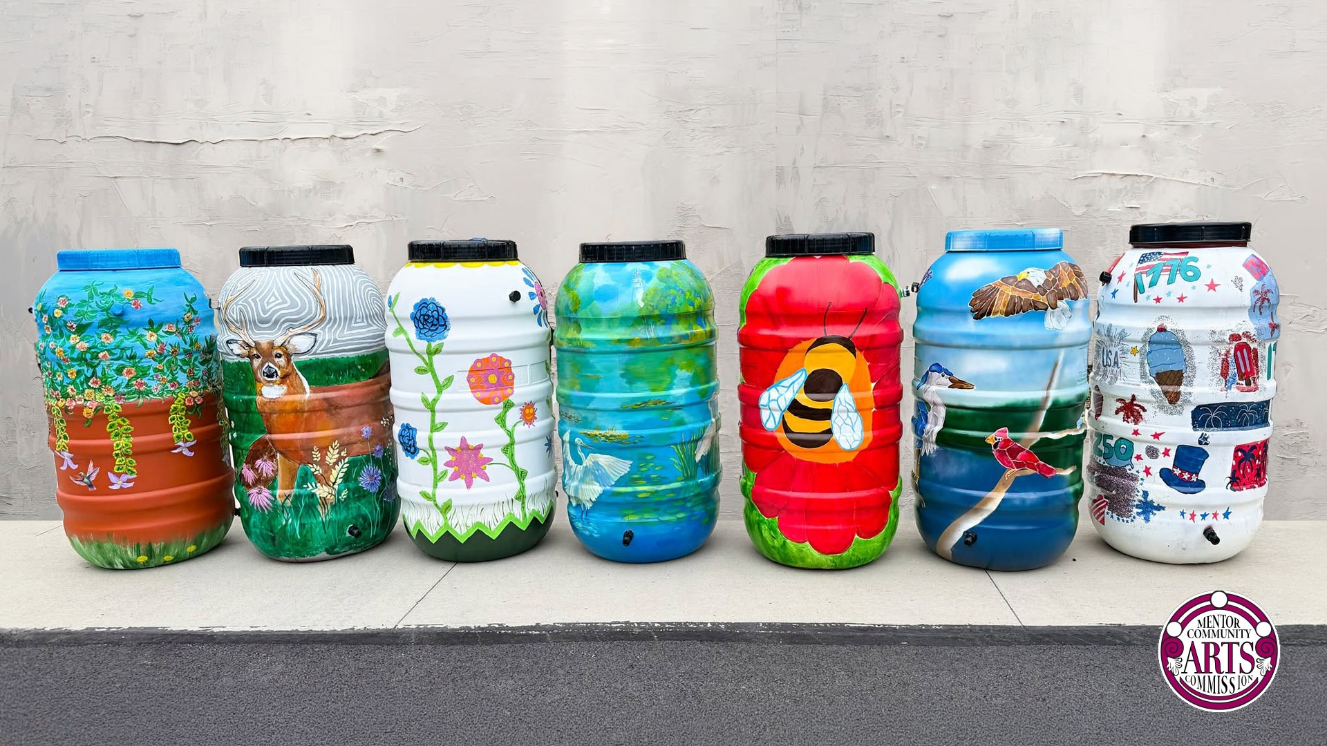 a row of colorful rain barrels.