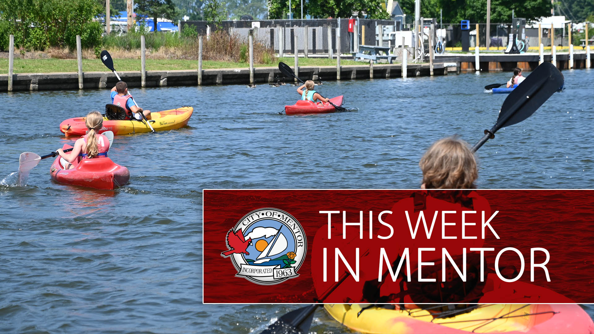 Kayakers on the water at the Mentor Lagoons Marina.