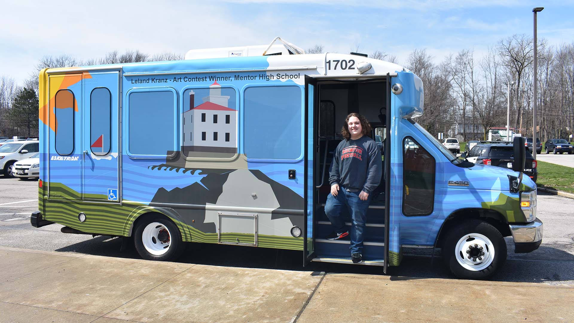 2022 Laketran Art Contest Winner Leland Kranz with his winning design named 'Creating a Cleaner Lake County'