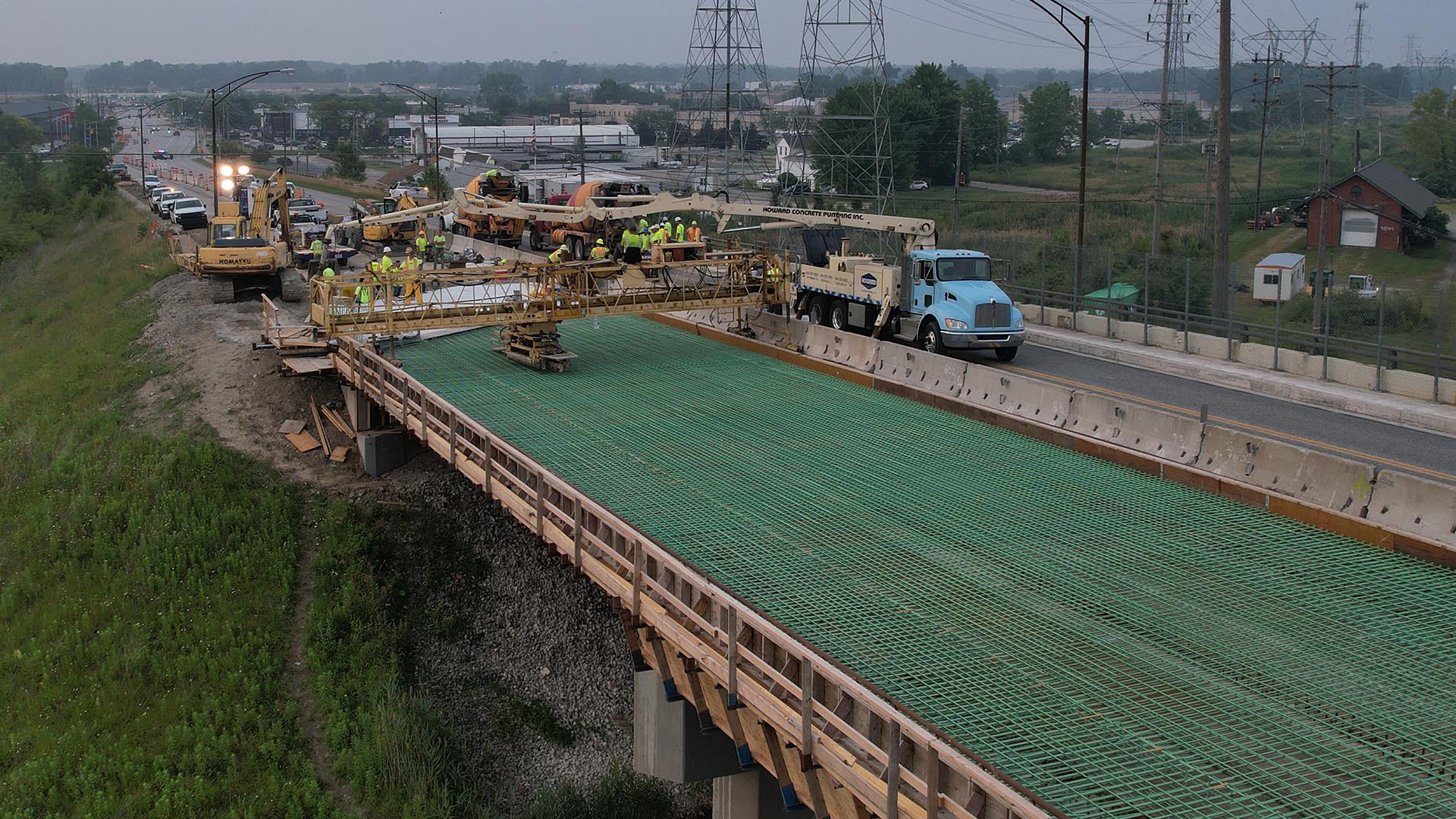 An image of a construction crew pouring concrete on the SR-615 overpass.
