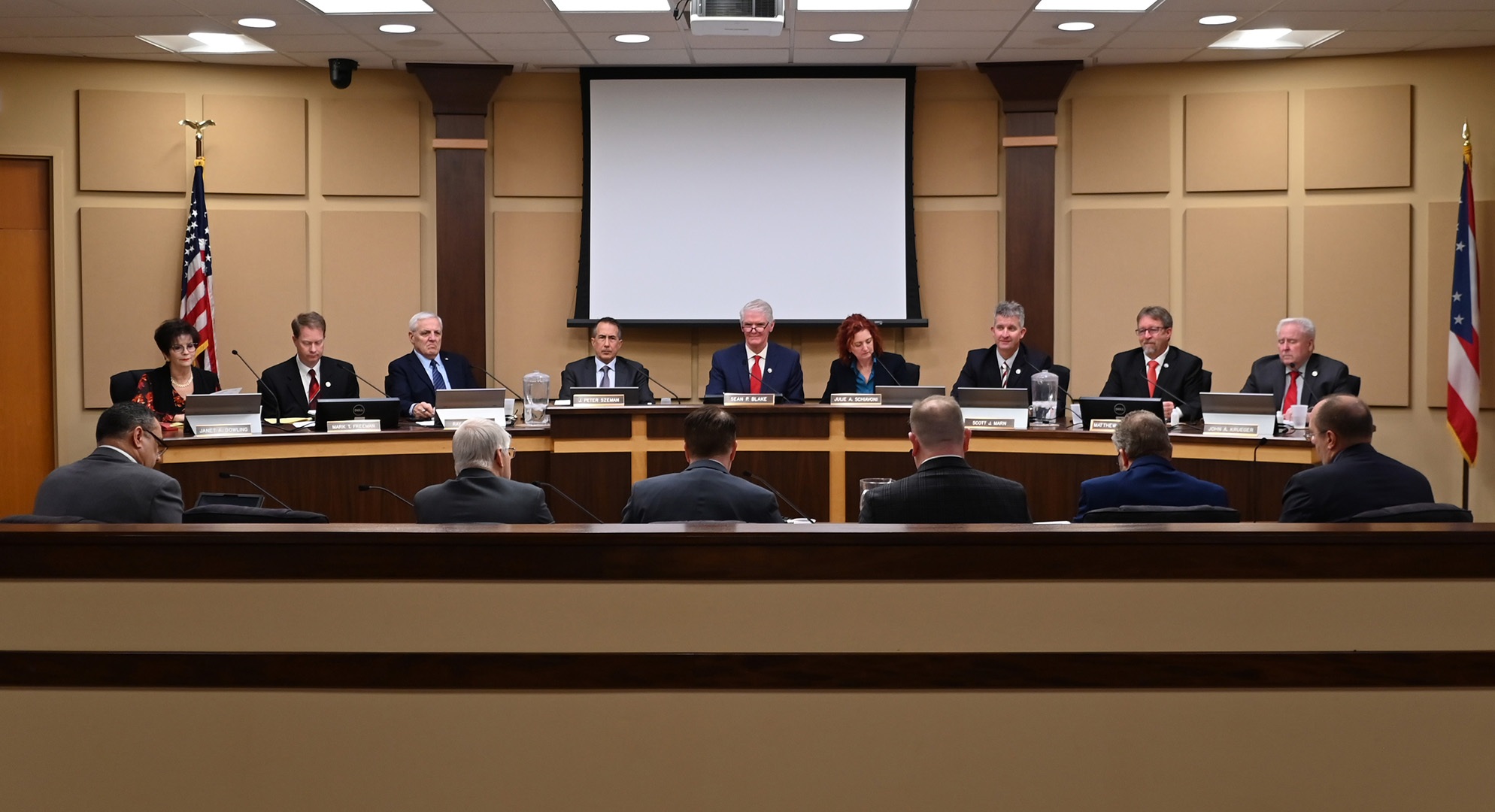 Image of Mentor City Council facing members of administration.