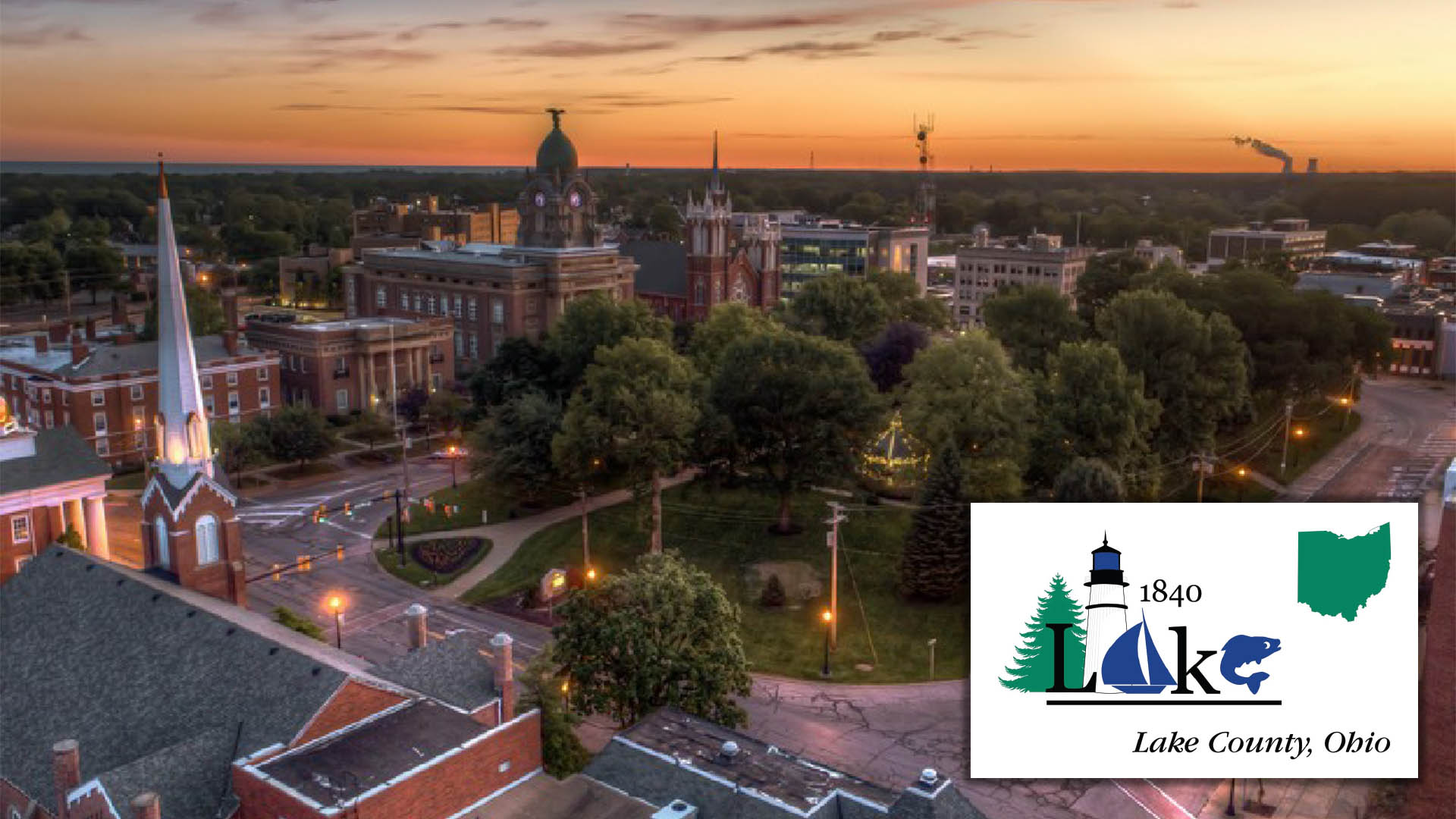 An aerial image of downtown Painesville at sunset. 