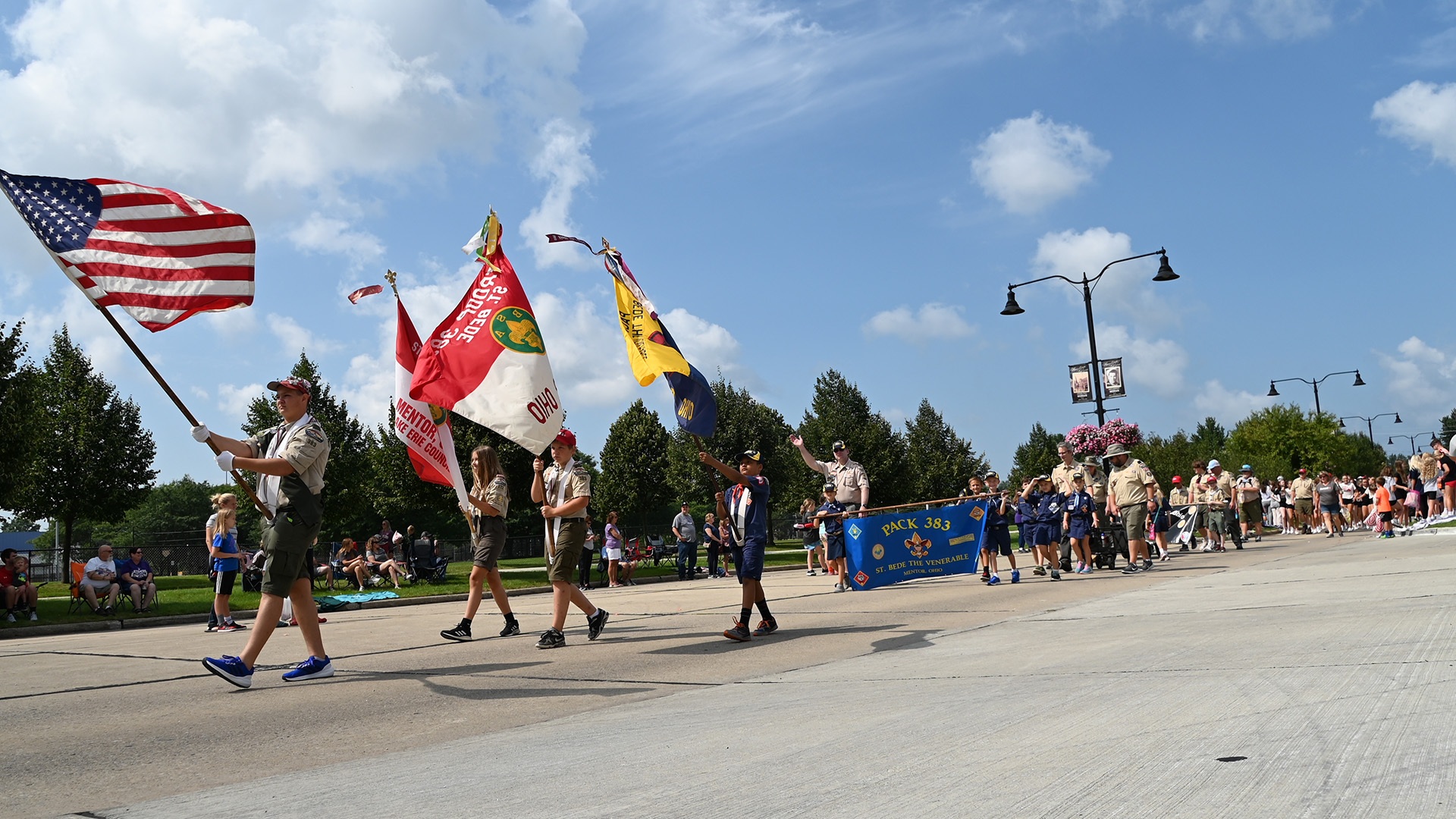 A group of people marching in the Mentor CityFest parade.