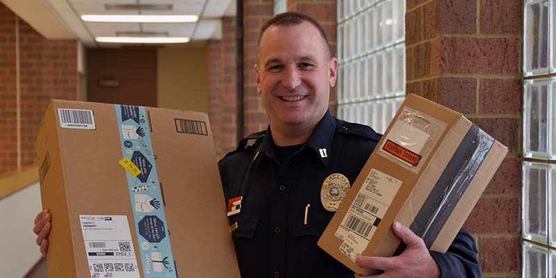 Mentor Police Captain Mike Majernik with GPS Bait Box