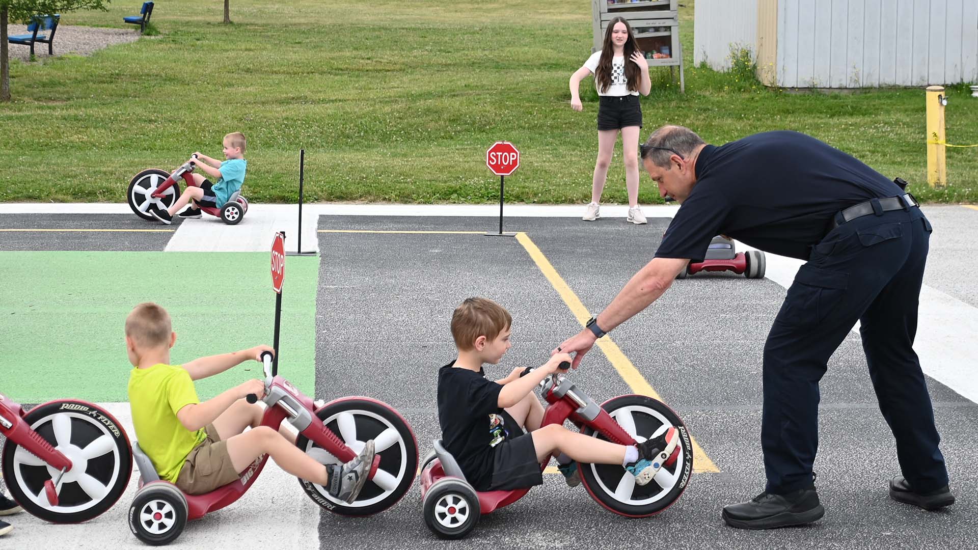 Officer Jack Skelly with children participating in Mentor Safety Town in 2024.