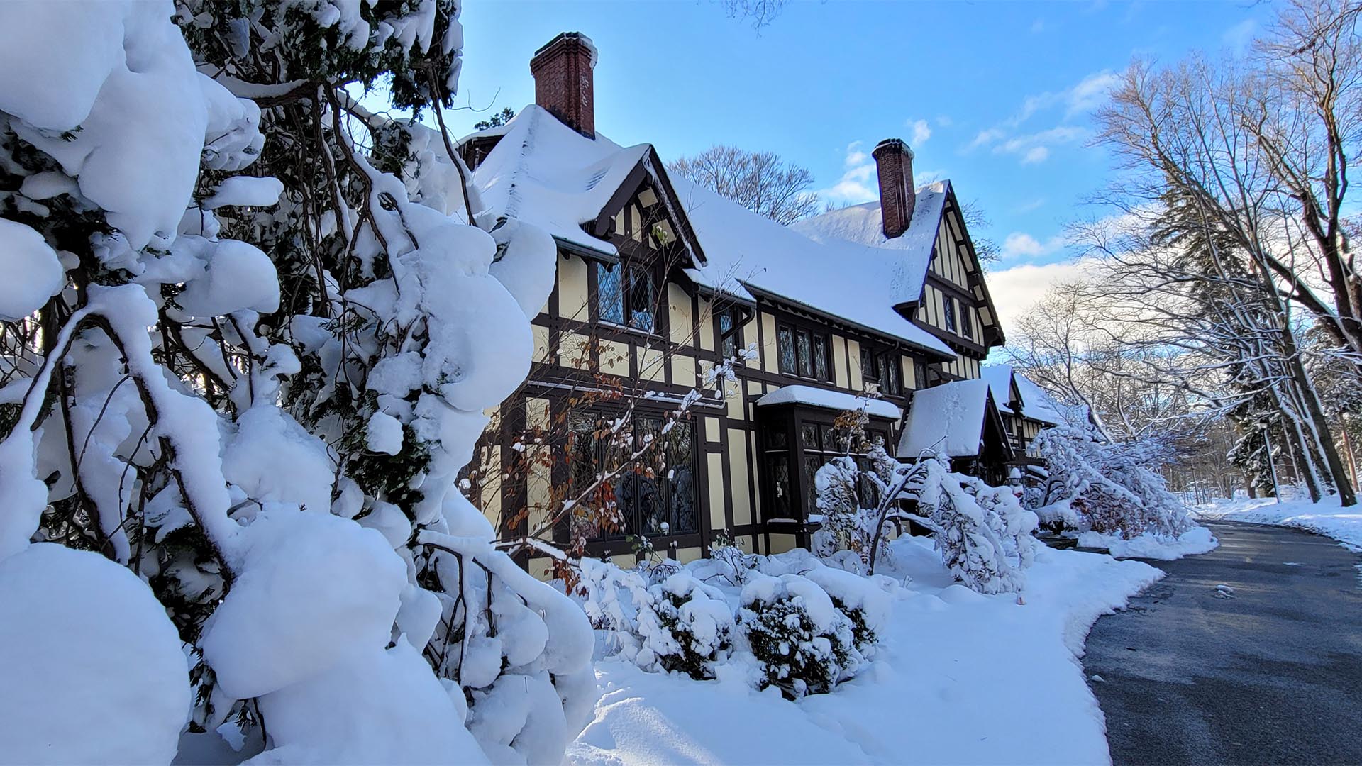 An image of the exterior of the Wildwood Cultural Center in Mentor, Ohio after a heavy snowfall.